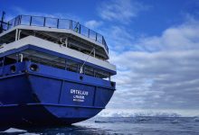 MV Ortelius expedition ship anchored in Robertson Bay near Cape Adare, Antarctica