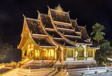Haw Pha Bang temple illuminated at night in Luang Prabang, Laos