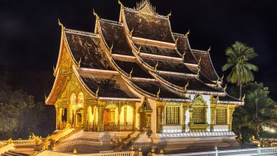 Haw Pha Bang temple illuminated at night in Luang Prabang, Laos