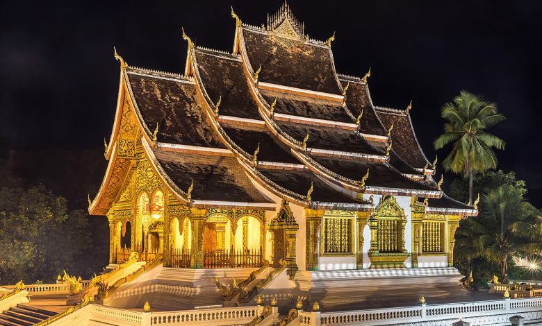 Haw Pha Bang temple illuminated at night in Luang Prabang, Laos