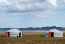 Two traditional Mongolian gers on the steppe