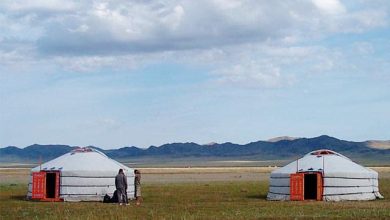 Two traditional Mongolian gers on the steppe