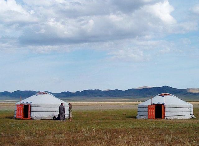 Two traditional Mongolian gers on the steppe