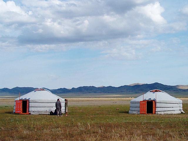Two traditional Mongolian gers on the steppe